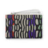 Rectangular wristlet clutch bag with psychedelic black, purple, red, and green pattern. White wrist strap and gold zipper visible